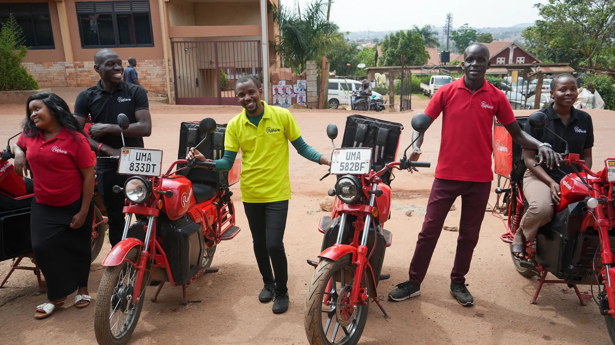 The Rapharm team with their delivery fleet in Kampala